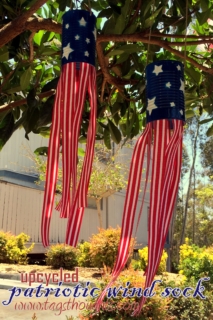 Using cans, spray paint, and ribbon, make these super cute windsocks to add a little red, white, and blue to your yard #4thofJuly #upcycled #craftproject