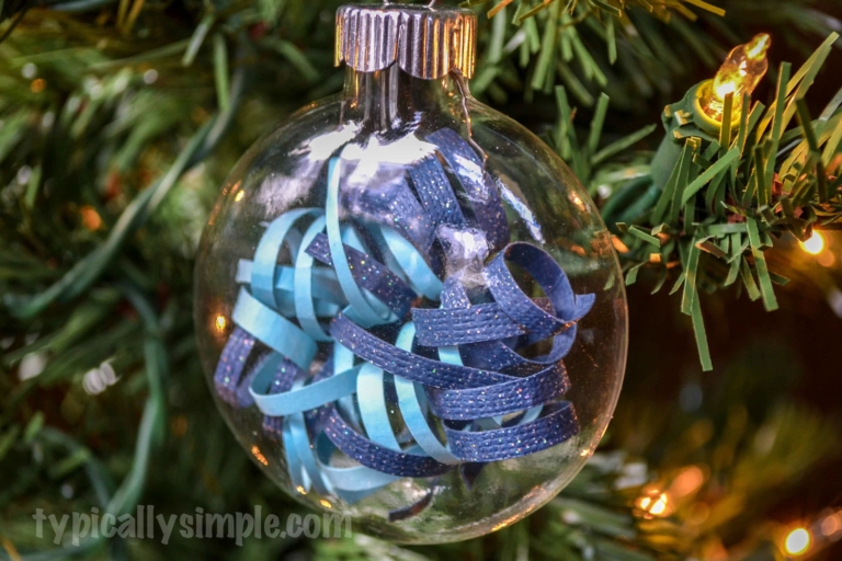 A fun DIY ornament that scrapbookers will love! Create a simple yet elegant ornament using strips of curled paper.