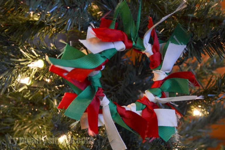 A fun Christmas ornament for kids using ribbon - perfect for them to make for grandparents and relatives.