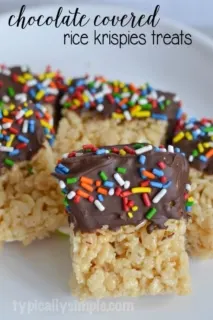 Dipping Rice Krispies treats into melted chocolate is a fun twist on a classic childhood treat we all know so well. A simple recipe to make with the kids!