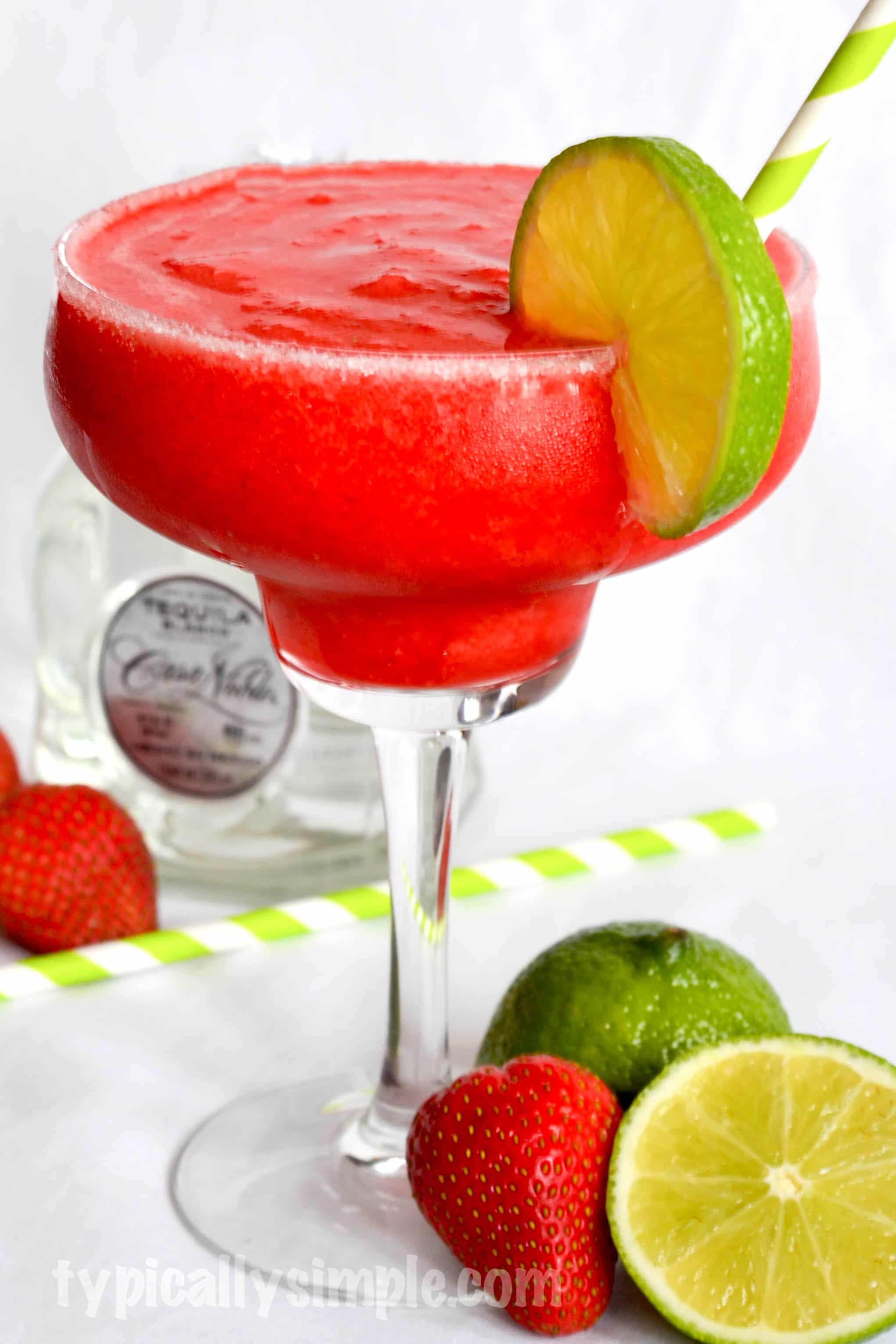 A delicious strawberry-lime margarita recipe that is easy to make and perfect to enjoy while relaxing by the pool or at the beach!
