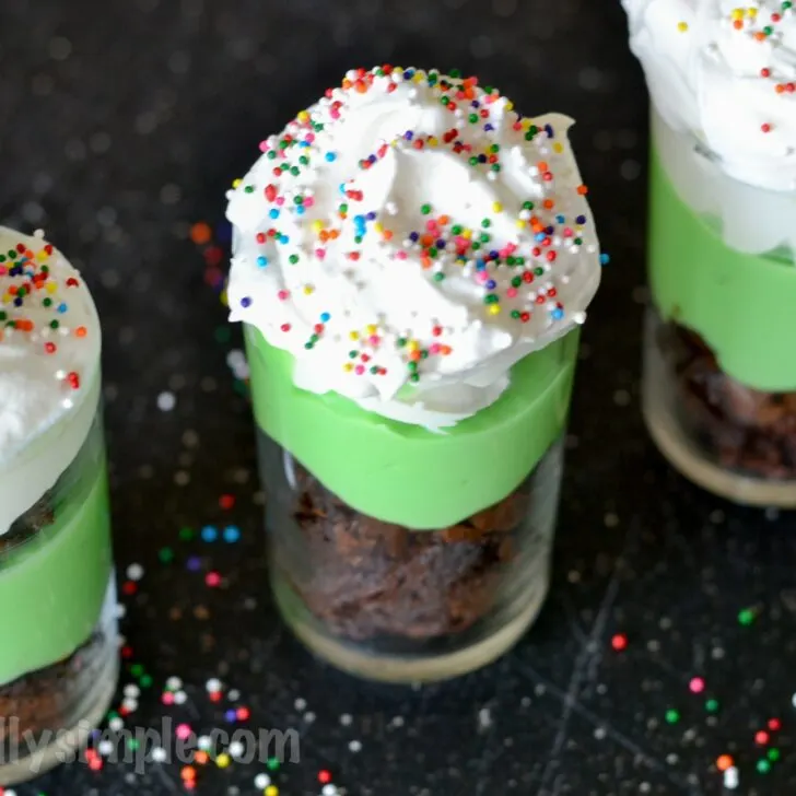 A festive treat perfect for St. Patrick's Day, these mint brownie dessert shooters are super easy to make and oh so yummy to eat!