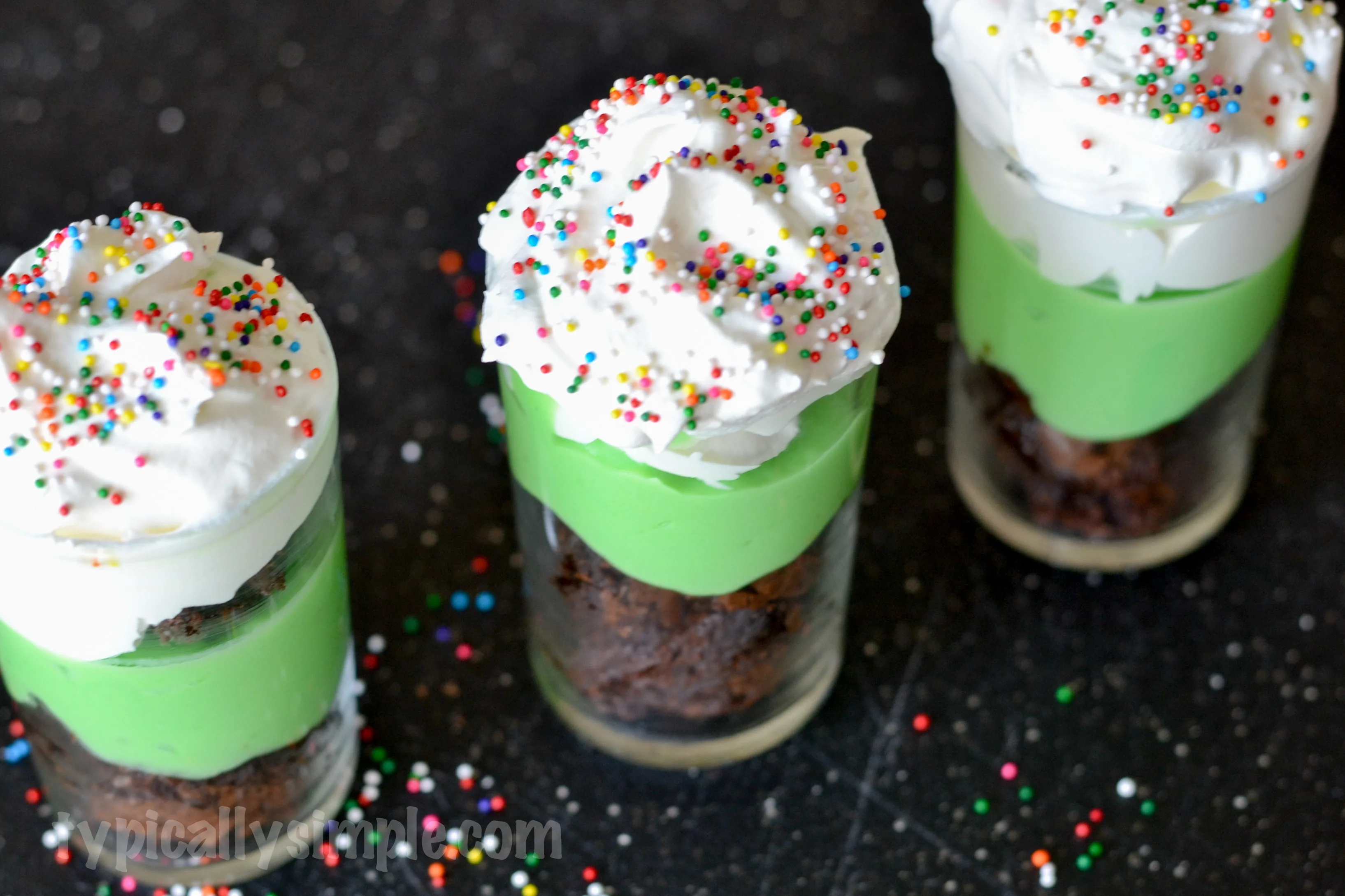 A festive treat perfect for St. Patrick's Day, these mint brownie dessert shooters are super easy to make and oh so yummy to eat!