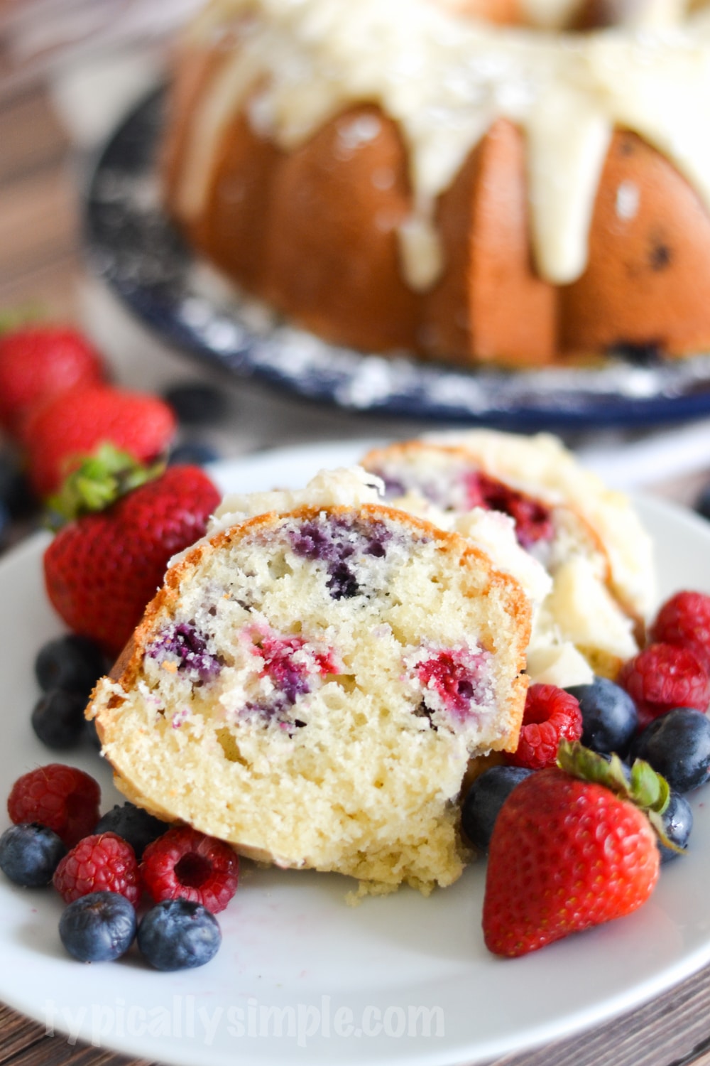 A decadent berry bundt cake recipe that is quite simple to make using fresh blueberries and raspberries. A delicious treat to serve with after dinner coffee!