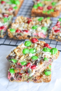 These Christmas Magic Cookie Bars are SO simple to make! They are a perfect treat to make with the kiddos for parties or to package up as a yummy gift.