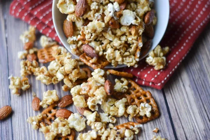 A sweet and salty treat that is perfect for snacking on while watching the game or a movie, this caramel corn snack mix is super easy to make in your crock pot!