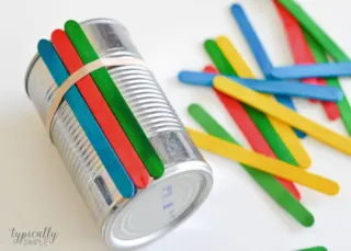 A colorful craft project to make with the kids, these craft stick flower pots are glue-free! A perfect handmade gift to give for Mother's Day or Teacher Appreciation.