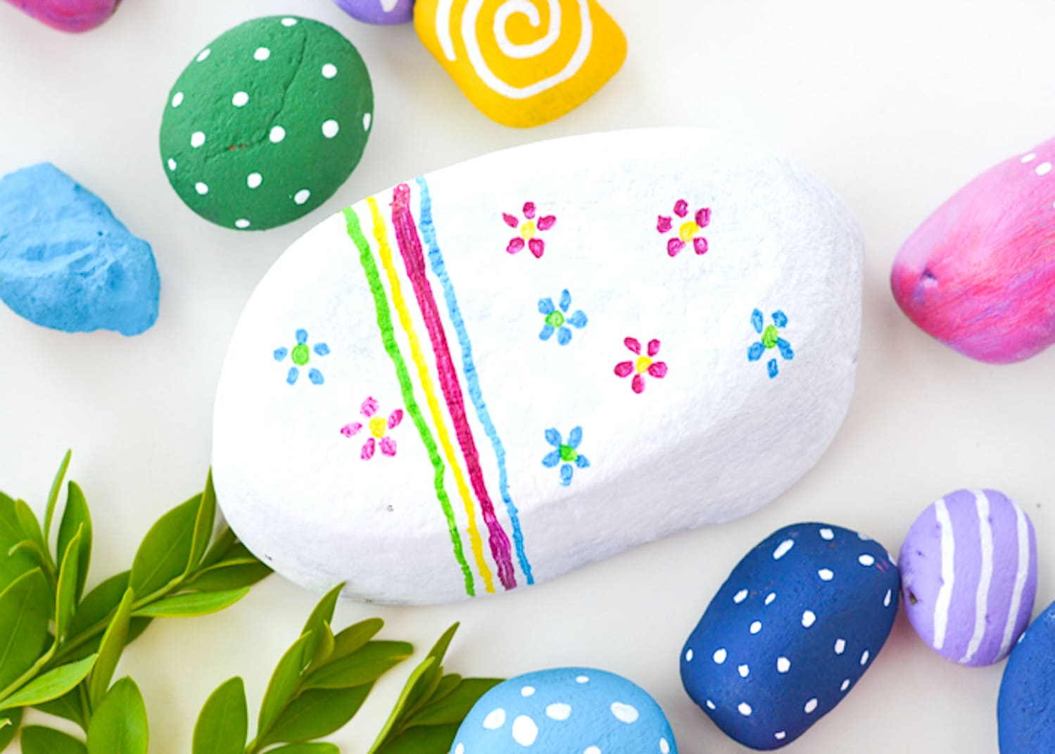 Get creative with this painted rock art project - a perfect craft for camping, at the cabin, or just in the backyard!