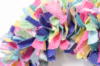 A fabric rag wreath is a fun way to add some color and texture to your front door!