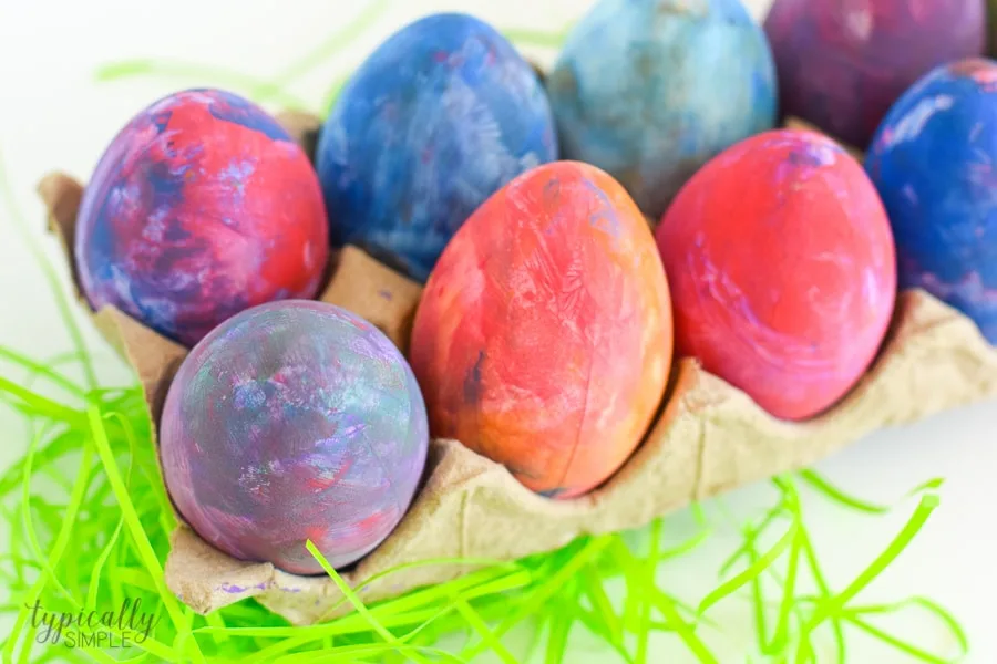 A fun alternative to using dye, grab some paint supplies to make these bright and colorful Easter eggs with the kids!