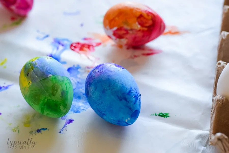 A fun alternative to using dye, grab some paint supplies to make these bright and colorful Easter eggs with the kids!