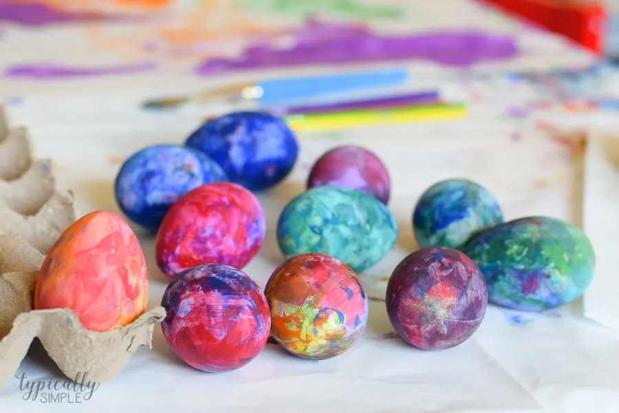 A fun alternative to using dye, grab some paint supplies to make these bright and colorful Easter eggs with the kids!