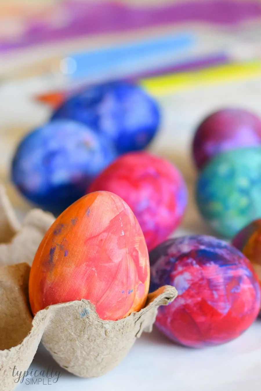 A fun alternative to using dye, grab some paint supplies to make these bright and colorful Easter eggs with the kids!