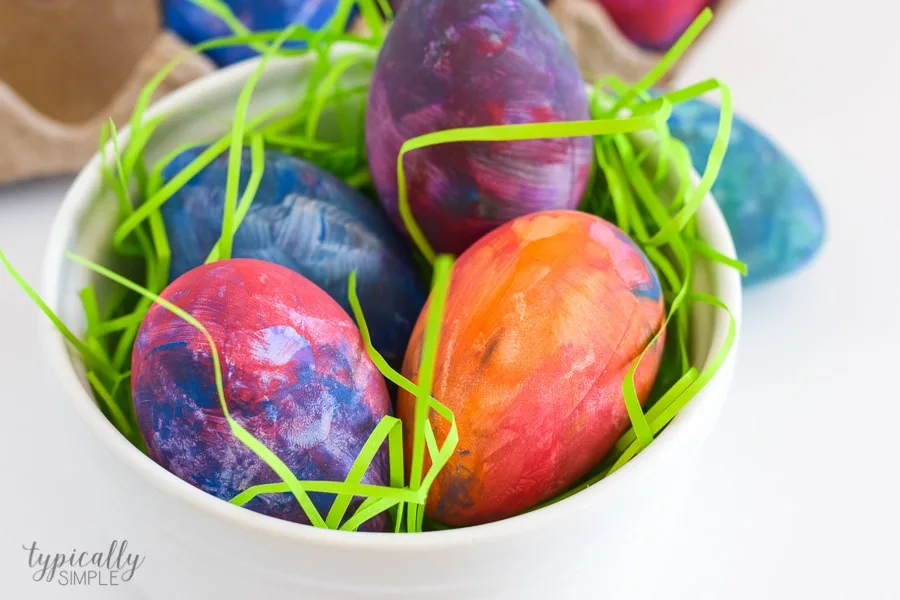 A fun alternative to using dye, grab some paint supplies to make these bright and colorful Easter eggs with the kids!