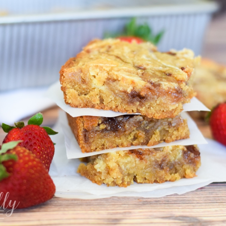 These strawberry swirl cheesecake blondie bars are a decadent treat that is quite easy to make. With some basic baking ingredients and a few minutes of prep they will quickly become your new go-to dessert to make for parties!